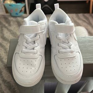Kids brand new white nikes.